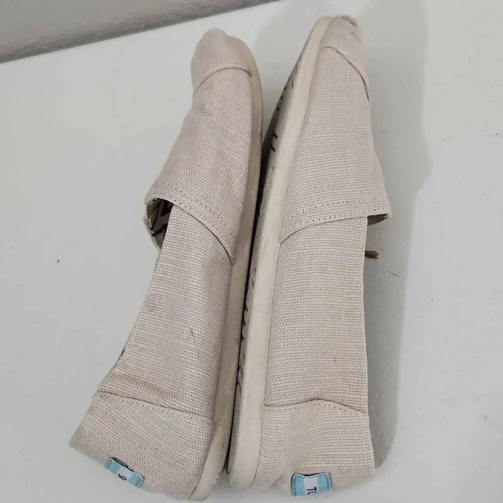 TOMS Shoes Size 9.5 Cream Canvas Slip-On has spots flaws